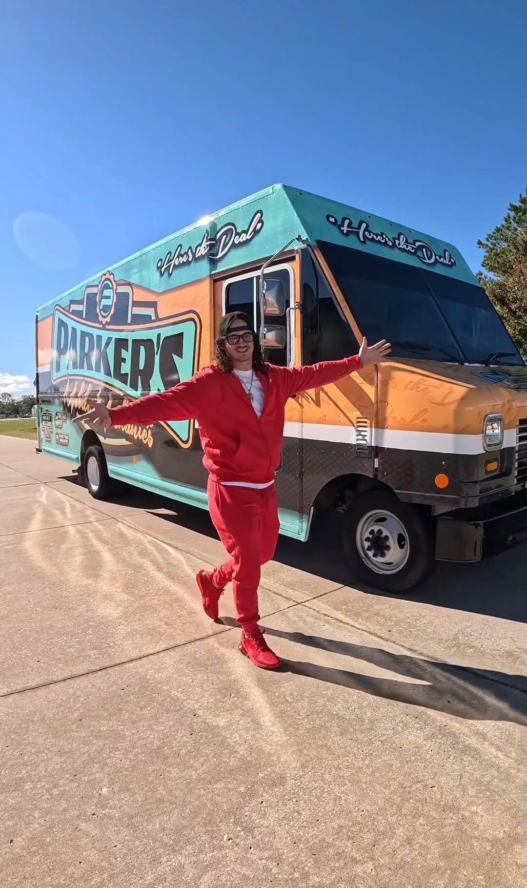 Parker standing with the Parker's Mobile Mechanics service truck